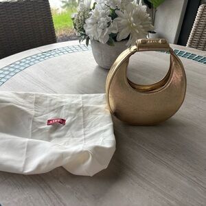 STAUD Metallic Gold Crescent Handbag